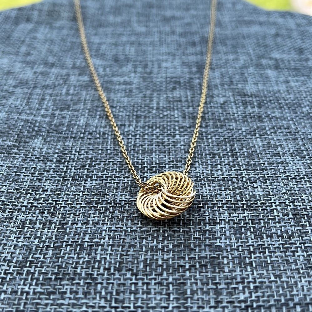 Shiny gold tone necklace spiral circle pendant